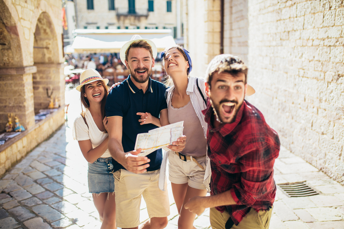 Happy group of tourists traveling and sightseeing